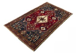 Corner detail of 2000s Shiraz rug showing border pattern and Wool pile