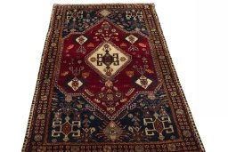 Surface texture of 2000s Shiraz rug with natural Wool and intricate pattern
