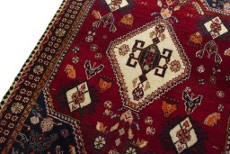 Backside of handmade 2000s Shiraz rug showing knot structure and weave density