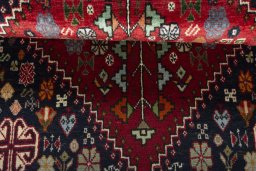 Corner detail of 2000s Shiraz rug showing border pattern and Wool pile
