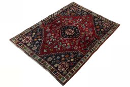 Corner detail of 2000s Shiraz rug showing border pattern and Wool pile