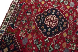 Backside of handmade 2000s Shiraz rug showing knot structure and weave density