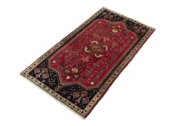 Corner detail of 2000s Shiraz rug showing border pattern and Wool pile