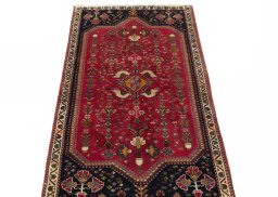 Surface texture of 2000s Shiraz rug with natural Wool and intricate pattern