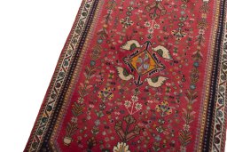 Backside of handmade 2000s Shiraz rug showing knot structure and weave density