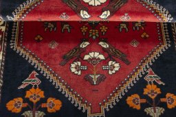 Corner detail of 2000s Shiraz rug showing border pattern and Wool pile