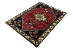 Corner detail of 2000s Shiraz rug showing border pattern and Wool pile