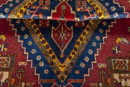Corner detail of 2000s Shiraz rug showing border pattern and Wool pile