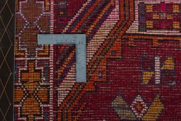 Surface texture of 2000s Shiraz rug with natural Wool and intricate pattern