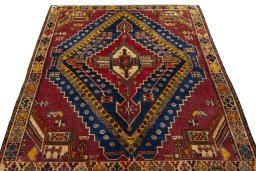 Surface texture of 2000s Shiraz rug with natural Wool and intricate pattern