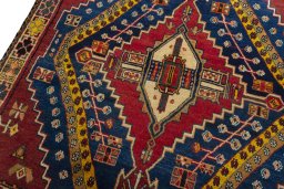 Backside of handmade 2000s Shiraz rug showing knot structure and weave density