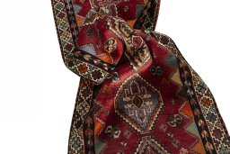 Corner detail of 2000s Shiraz rug showing border pattern and Wool pile