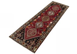 Corner detail of 2000s Shiraz rug showing border pattern and Wool pile