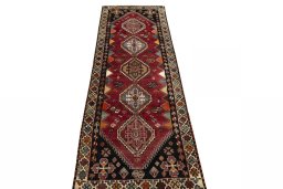 Surface texture of 2000s Shiraz rug with natural Wool and intricate pattern