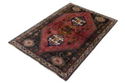 Corner detail of 2000s Shiraz rug showing border pattern and Wool pile
