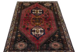 Surface texture of 2000s Shiraz rug with natural Wool and intricate pattern