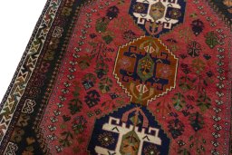 Backside of handmade 2000s Shiraz rug showing knot structure and weave density