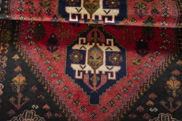 Full view of 2000s Shiraz rug from Iran / Persia, 188 × 127 cm in Red tones