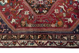 Corner detail of 2000s Shiraz rug showing border pattern and Wool pile