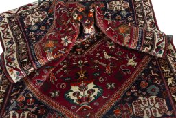 Surface texture of 2000s Shiraz rug with natural Wool and intricate pattern