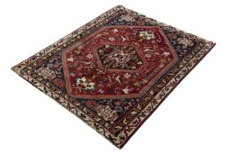 Corner detail of 2000s Shiraz rug showing border pattern and Wool pile