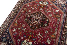 Backside of handmade 2000s Shiraz rug showing knot structure and weave density