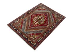 Corner detail of 1970s Shiraz rug showing border pattern and Wool pile