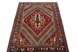 Surface texture of 1970s Shiraz rug with natural Wool and intricate pattern