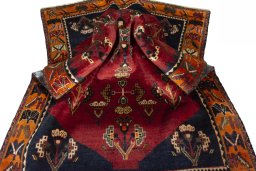 Corner detail of 2000s Shiraz rug showing border pattern and Wool pile