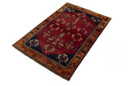 Corner detail of 2000s Shiraz rug showing border pattern and Wool pile