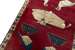 Backside of handmade 2000s Shiraz rug showing knot structure and weave density