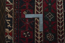 Corner detail of 2000s Shiraz rug showing border pattern and Wool pile