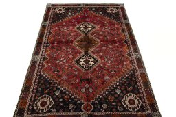Surface texture of 1970s Shiraz rug with natural Wool and intricate pattern