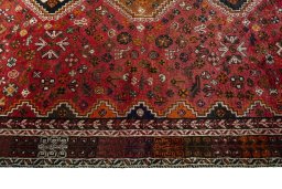 Full view of 1970s Shiraz rug from Iran / Persia, 281 × 177 cm in Red tones