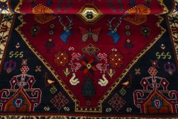 Corner detail of 2000s Shiraz rug showing border pattern and Wool pile