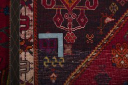 Surface texture of 2000s Shiraz rug with natural Wool and intricate pattern