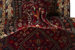 Corner detail of 2000s Shiraz rug showing border pattern and Wool pile