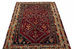 Surface texture of 2000s Shiraz rug with natural Wool and intricate pattern