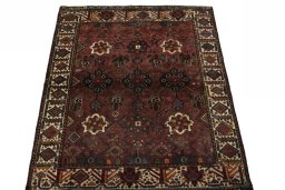 Surface texture of 1970s Shiraz rug with natural Wool and intricate pattern