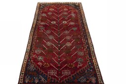 Surface texture of 2000s Shiraz rug with natural Wool and intricate pattern