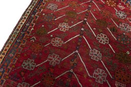 Backside of handmade 2000s Shiraz rug showing knot structure and weave density