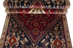 Corner detail of 2000s Shiraz rug showing border pattern and Wool pile