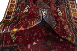 Corner detail of 2000s Shiraz rug showing border pattern and Wool pile