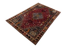 Corner detail of 2000s Shiraz rug showing border pattern and Wool pile