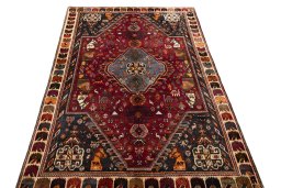 Surface texture of 2000s Shiraz rug with natural Wool and intricate pattern