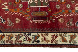 Corner detail of 2000s Shiraz rug showing border pattern and Wool pile