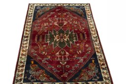 Surface texture of 2000s Shiraz rug with natural Wool and intricate pattern
