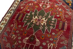 Backside of handmade 2000s Shiraz rug showing knot structure and weave density