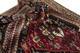 Surface texture of 1970s Shiraz rug with natural Wool and intricate pattern