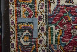 Backside of handmade 1970s Shiraz rug showing knot structure and weave density